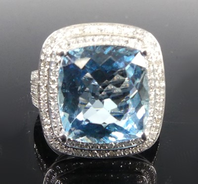 Lot 1166 - A white metal blue topaz and diamond cushion...