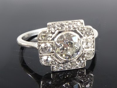 Lot 1151 - An Art Deco platinum diamond panel ring,...