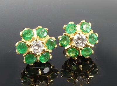 Lot 1174 - A pair of 18ct yellow gold, emerald and...