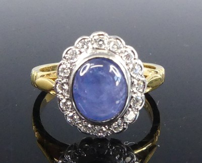 Lot 1157 - An 18ct yellow and white gold, sapphire and...