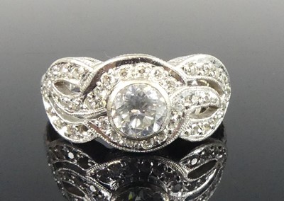 Lot 1185 - A white metal diamond crossover multi-strand...
