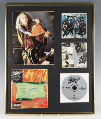 Lot 701 - The Darkness - a framed presentation to...
