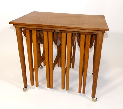 Lot 355 - A 1970s teak nest of five occasional...