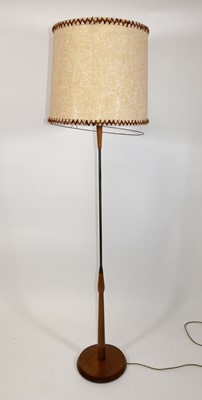 Lot 354 - A 1960s teak and rodded tubular metal standard...