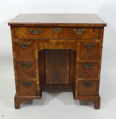 Lot 1426 - A George II figured walnut and crossbanded...