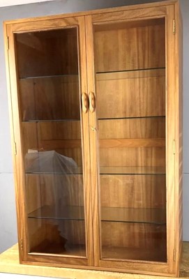 Lot 366 - A 1970s Ladderax teak double door glazed...