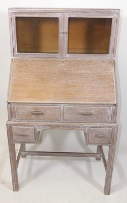 Lot 344 - In the manner of Heal's - a 1930s limed oak...