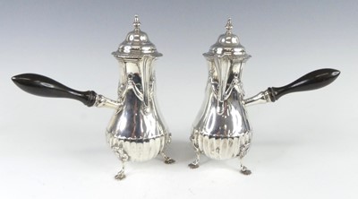 Lot 1109 - A pair of late Victorian silver chocolate pots,...