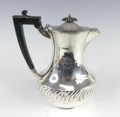 Lot 1107 - A late Victorian silver hot water pot, of pear...