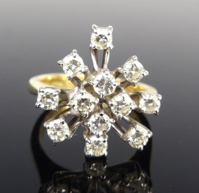 Lot 1184 - An 18ct yellow and white gold diamond abstract...