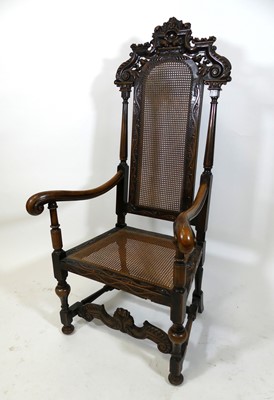 Lot 1451 - A Caroleon style carved walnut framed and...