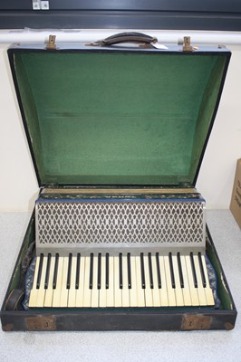 Lot 590 - A Hohner Tango piano accordion, cased.