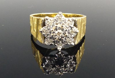 Lot 427 - A modern 18ct gold and diamond flower head...