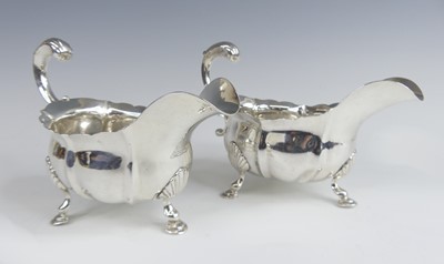 Lot 1092 - A pair of George III silver sauce boats, each...