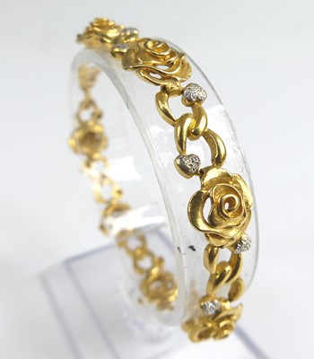 Lot 1195 - A carved yellow metal bracelet, having...
