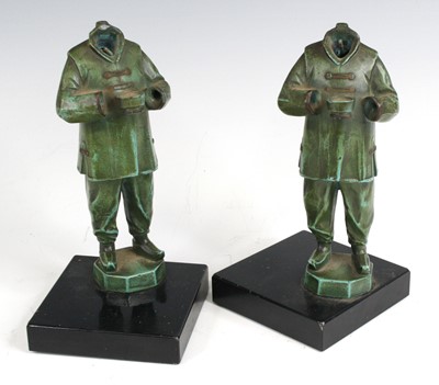 Lot 161 - A pair of Art Deco green patinated art metal...
