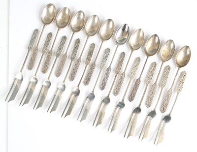 Lot 101 - A set of eleven silver cocktail forks by...
