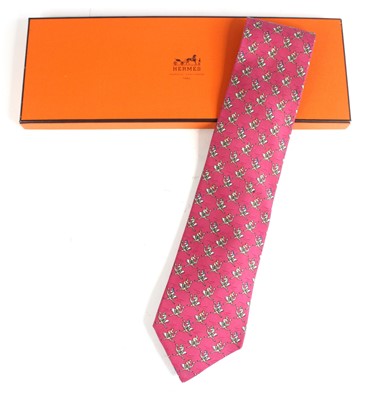 Lot 126 - Hermès of Paris - a silk tie, pink colour with...