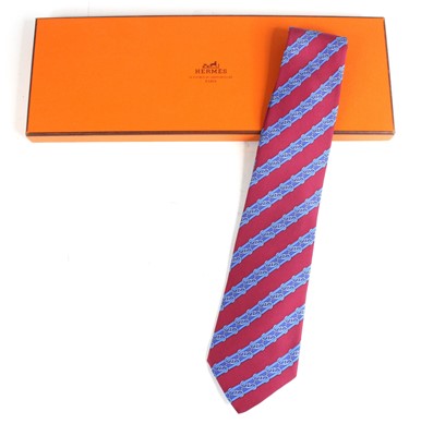 Lot 127 - Hermès of Paris - a silk tie, burgundy and...