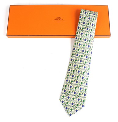 Lot 128 - Hermès of Paris - a silk tie, the cream ground...