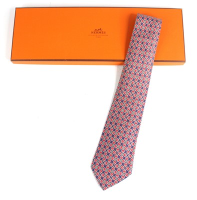 Lot 129 - Hermès of Paris - a silk tie, the blue ground...