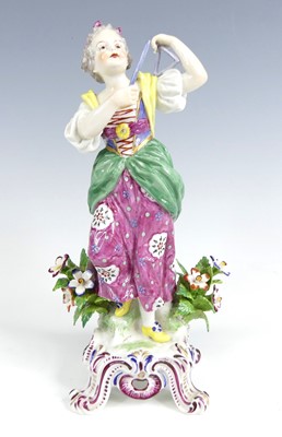 Lot 1044 - A Bow porcelain figurine of a musician, circa...