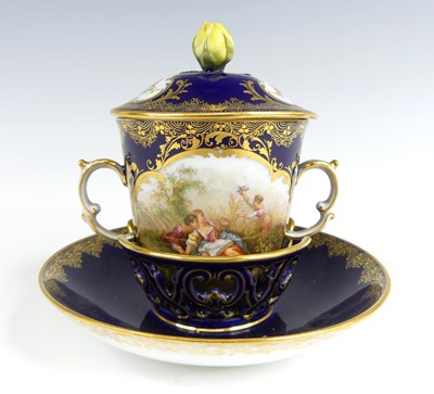Lot 1068 - A Meissen porcelain twin handled chocolate cup,...