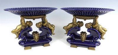 Lot 1248 - A pair of French porcelain and brass table...