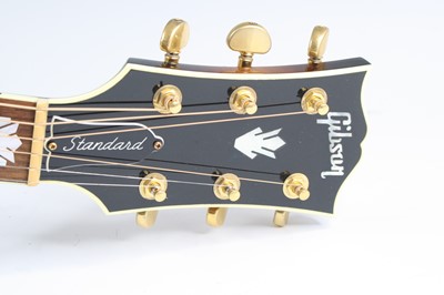 Lot 586 - A Gibson Standard SJ-200 electro acoustic...
