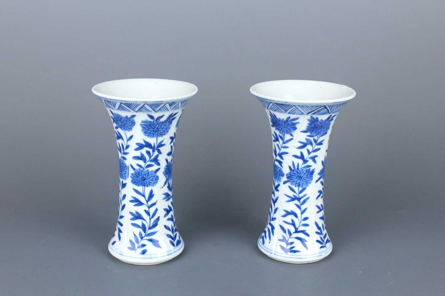 Lot 2039 - A pair of Chinese blue and white gu vases,...