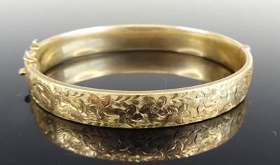 Lot 1161 - A Victorian style 9ct gold hinged bangle, one...