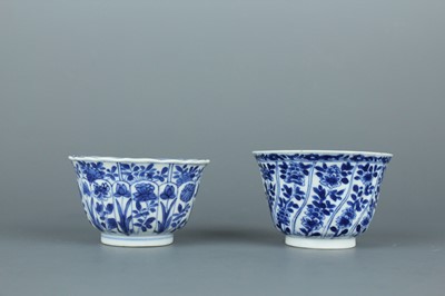 Lot 49 - A near pair of Chinese blue and white cups,...
