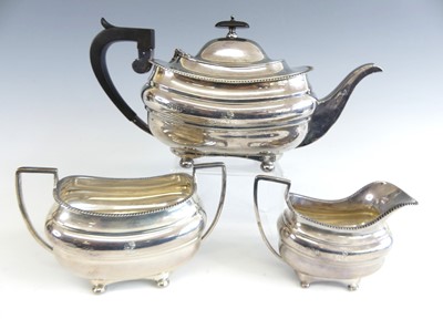 Lot 1134 - A George V silver three-piece tea set,...