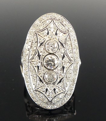 Lot 1150 - An Art Deco platinum diamond oval panel ring,...