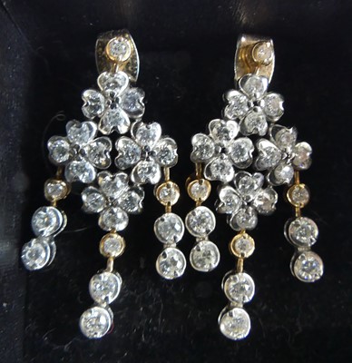Lot 1176 - A pair of 18ct white and rose gold diamond...
