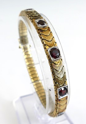 Lot 1164 - A yellow metal articulated chevron link...