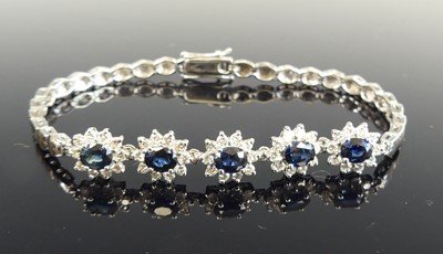 Lot 1193 - A white metal sapphire and diamond bracelet,...