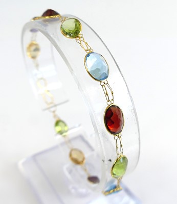 Lot 1172 - A contemporary yellow metal multi-stone...