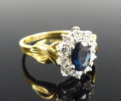 Lot 1155 - An 18ct yellow and white gold, sapphire and...