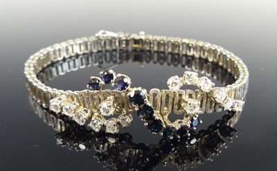 Lot 1192 - A white metal sapphire and diamond bracelet,...