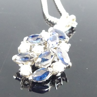 Lot 1178 - An 18ct white gold sapphire and diamond...