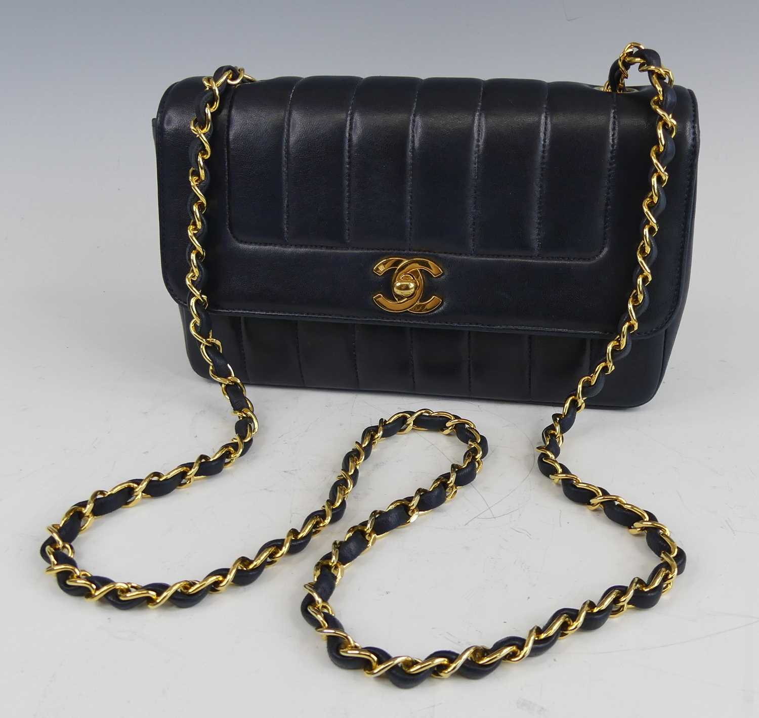 Lot 134 - Coco Chanel - a navy leather 'Madamoiselle'...