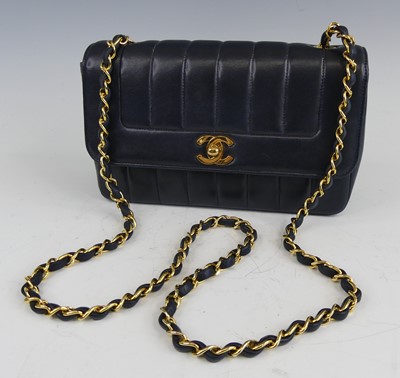 Lot 134 - Coco Chanel - a navy leather 'Madamoiselle'...
