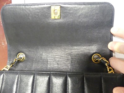 Lot 134 - Coco Chanel - a navy leather 'Madamoiselle'...