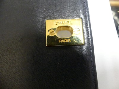 Lot 134 - Coco Chanel - a navy leather 'Madamoiselle'...