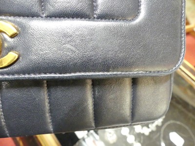 Lot 134 - Coco Chanel - a navy leather 'Madamoiselle'...