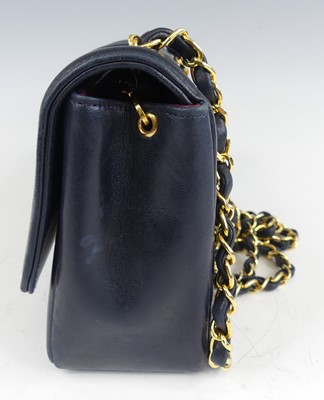 Lot 134 - Coco Chanel - a navy leather 'Madamoiselle'...