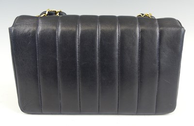 Lot 134 - Coco Chanel - a navy leather 'Madamoiselle'...