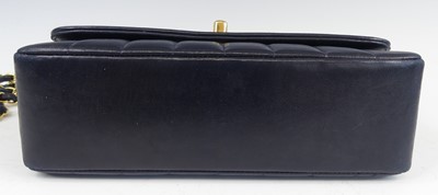 Lot 134 - Coco Chanel - a navy leather 'Madamoiselle'...
