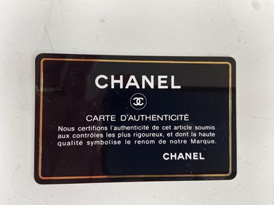 Lot 134 - Coco Chanel - a navy leather 'Madamoiselle'...